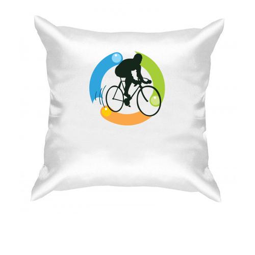 Подушка з велосипедистом і частинками