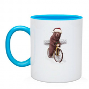 Чашка з ведмедем у шапці Санти та на велосипеді