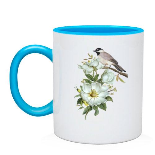 Чашка з птицею на гілці з квітами