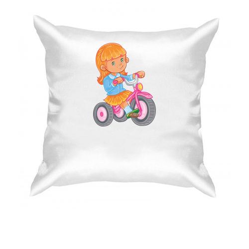 Подушка з дівчинкою на велосипеді