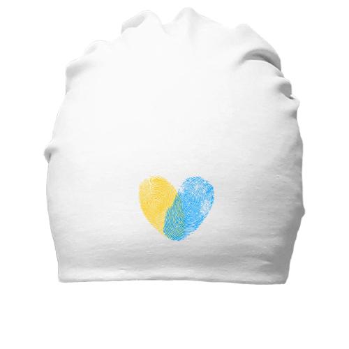 Бавовняна шапка жовто-синіми відбитками у вигляді серця