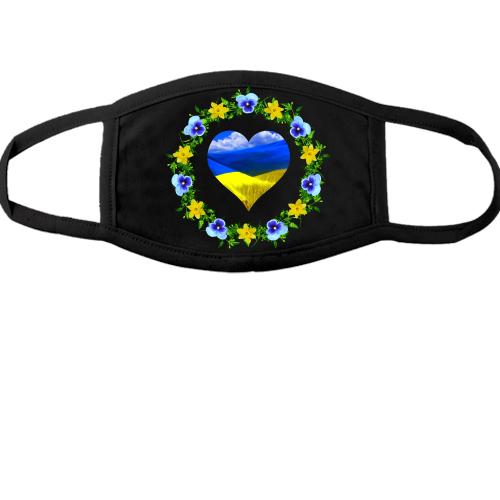 Тканинна маска для обличчя Жовто-синє серце у вінку квітів