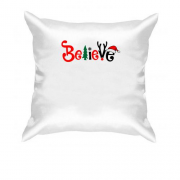 Подушка з написом "believe"