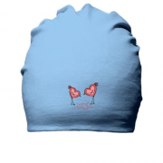 Хлопковая шапка птицы в форме сердечек.